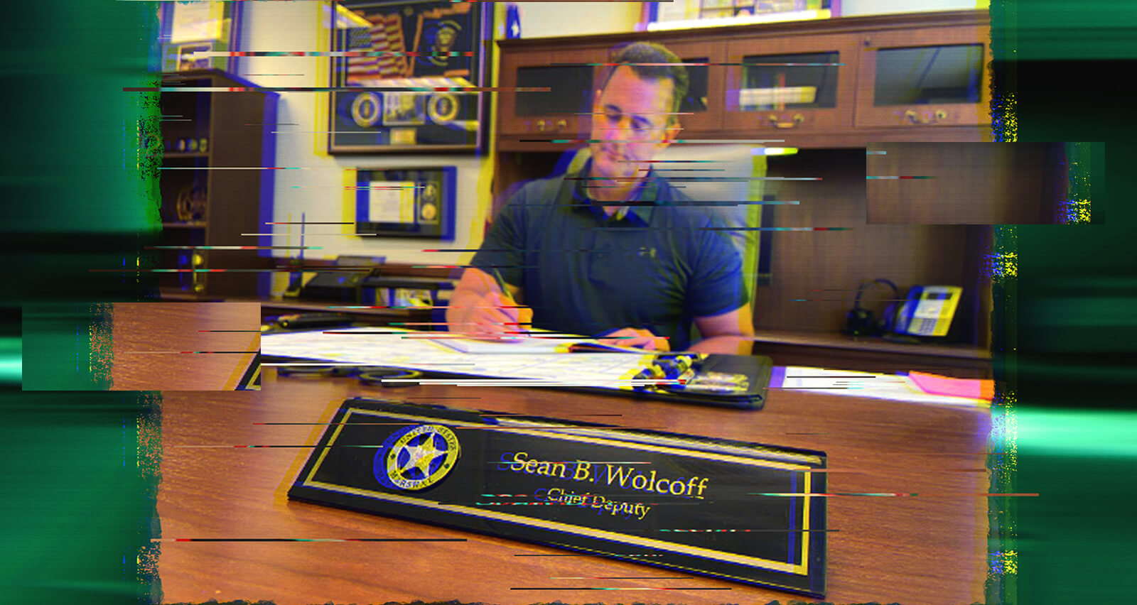 Sean Wolcoff sitting at his desk.